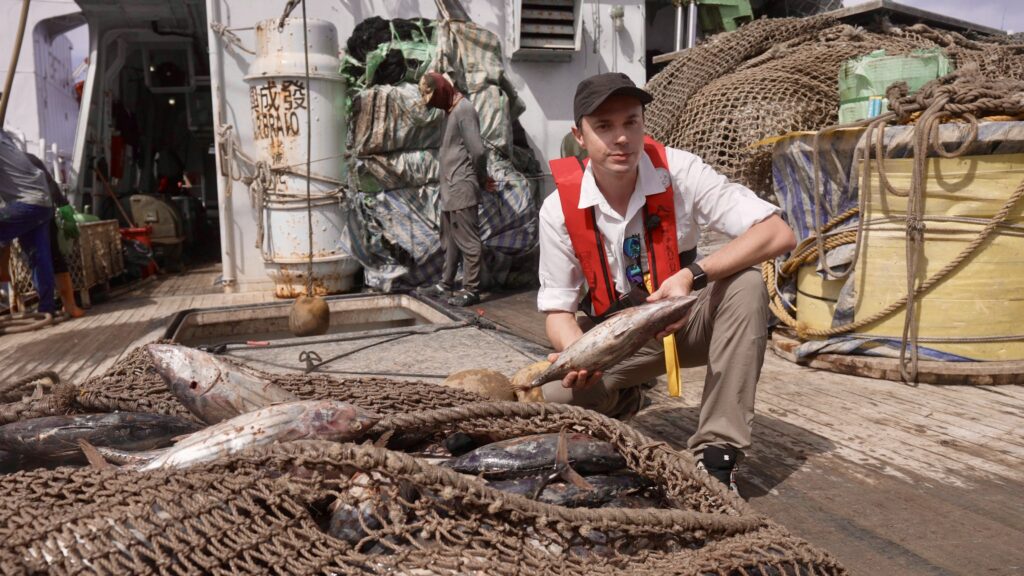 Author and host of the "Ocean" TV series Denis Loctier on a fishing seiner at Majuro Atoll, Marshall Islands